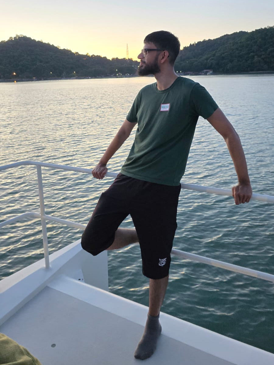 Man wearing modest swimwear for Men by ZAYFA on boat